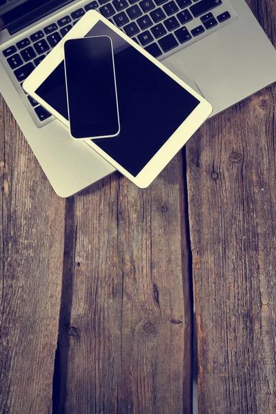 Electronics on wooden table