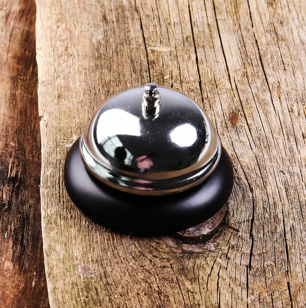 Metallic Ring bell on table