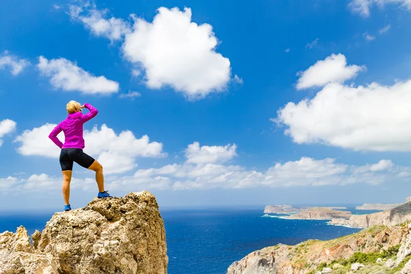 Woman climber or runner winner reaching life goal success on top