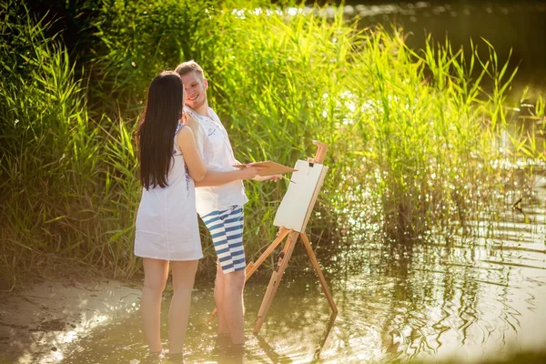 Young couple in love painting