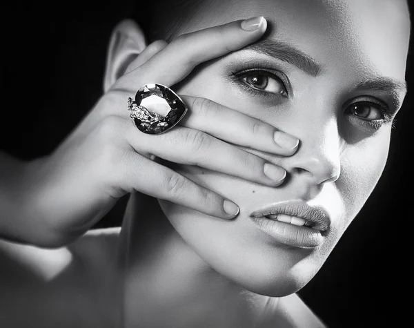 Young woman with makeup in luxury jewelry