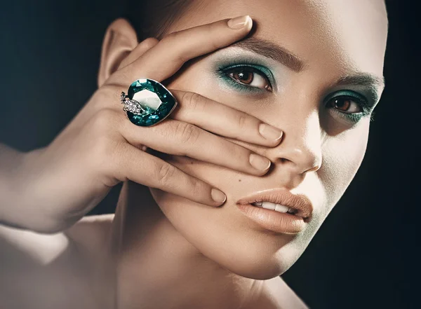 Young woman with makeup in luxury jewelry