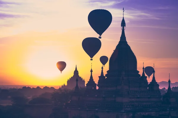 Hot air balloons flying over Buddhist Temples at Bagan. Myanmar