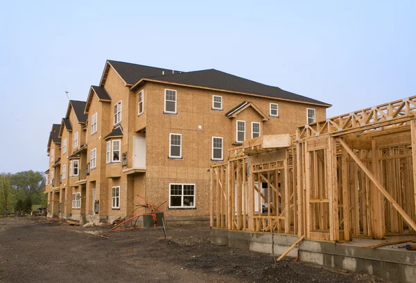 Housing under construction in various stages of development