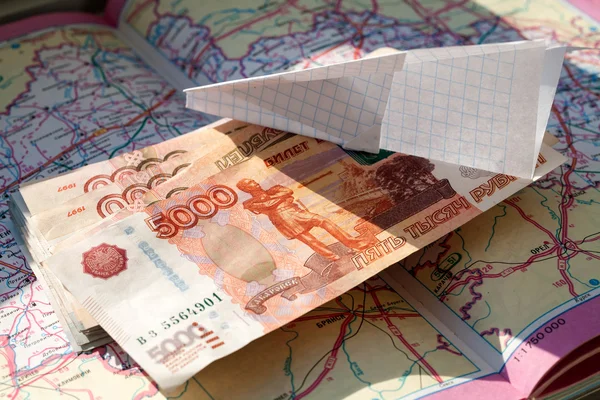 Paper plane and Russian Ruble on the map