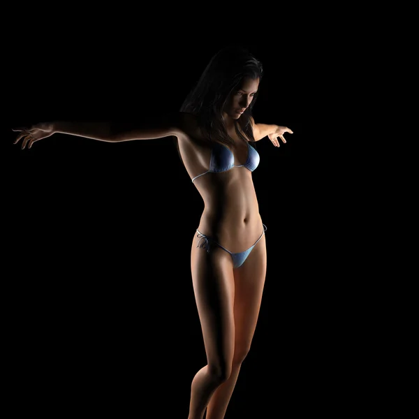 Sexy brunette bikini woman posing in dark studio