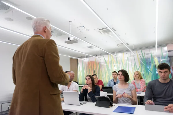 Teacher with a group of students in classroom