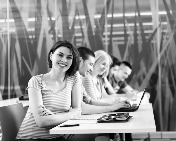 Group of students study together in classroom