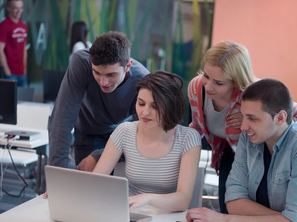 Group of students study together in classroom