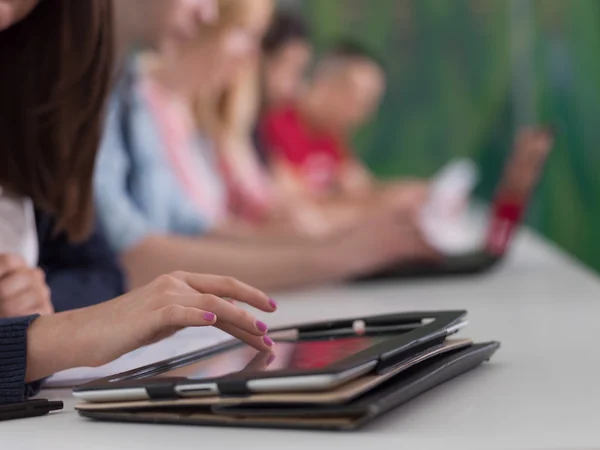 Group of students study together in classroom