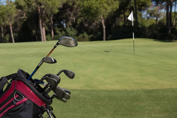 Close up golf bag on course