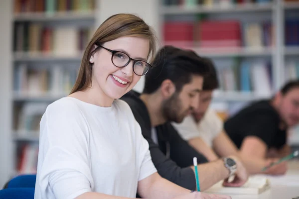 Group of students study together in classroom