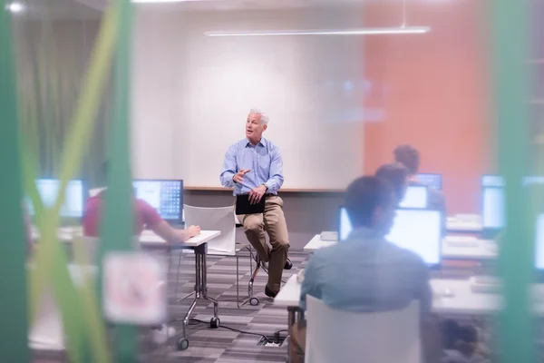 Teacher and students in computer lab classroom