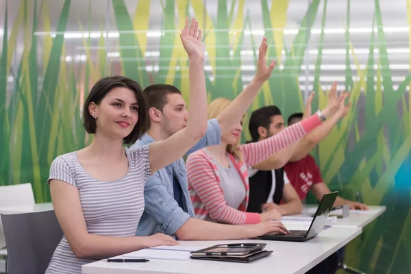 Students group raise hands up