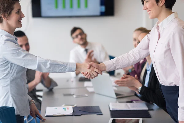 Business womans handshake