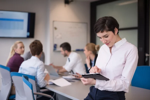 Business woman on meeting  using tablet