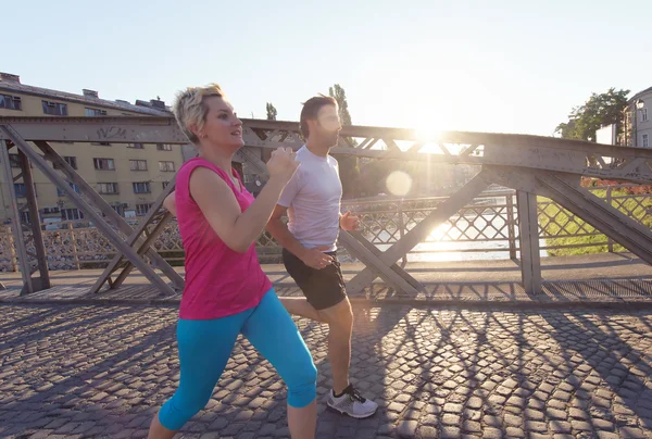Healthy mature couple jogging