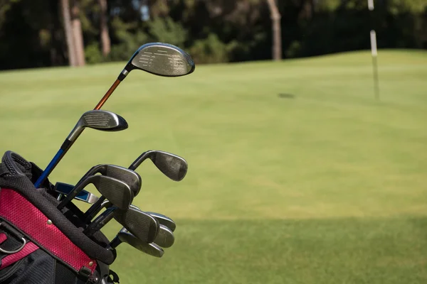 Close up golf bag on course