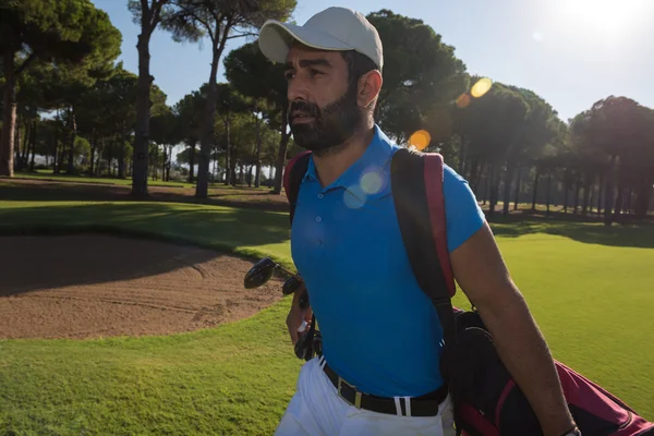 Golf player walking