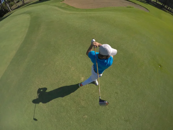 Top view of golf player hitting shot
