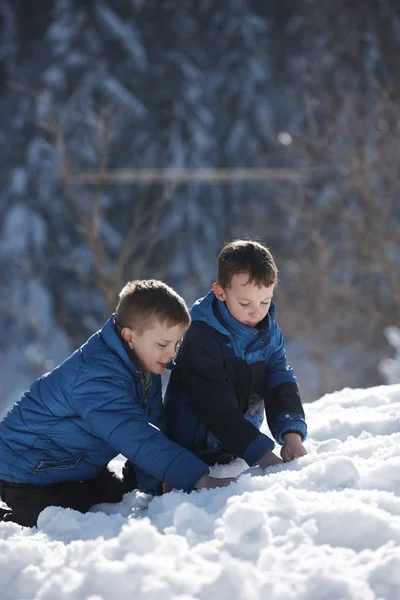 Kids playing with  fresh snow