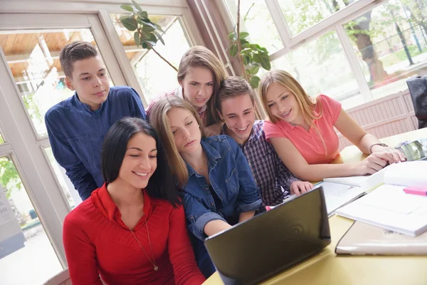 Happy teens group in school