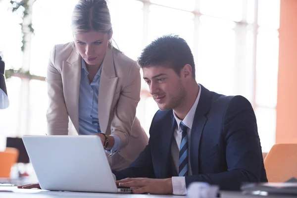 Businessman and woman at office