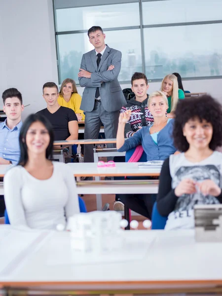 Students with teacher in computer lab classroom