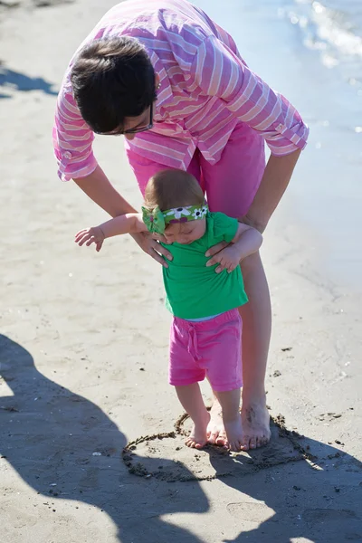 Mom and baby on beach