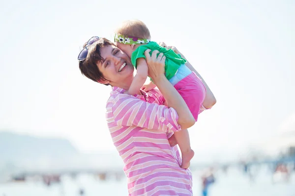 Mom and baby on beach