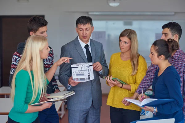 Group of students working with teacher