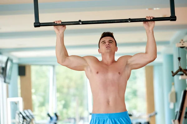 Young man working out in gym