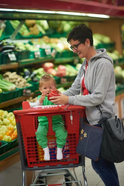 Mother with baby in shopping mall