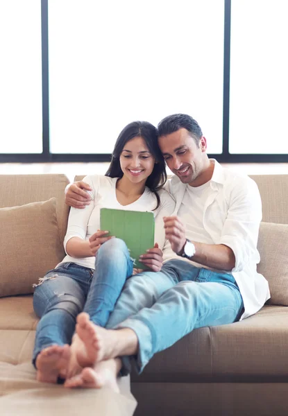 Couple using tablet computer