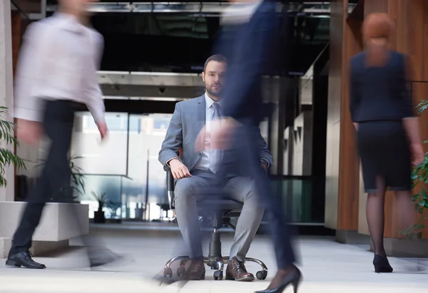 Business man sitting in office chair