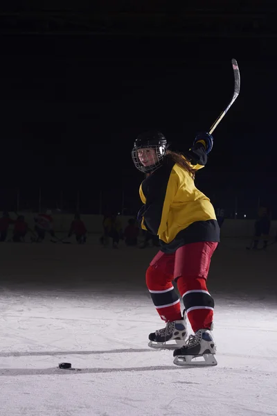 Teen ice hockey player in action