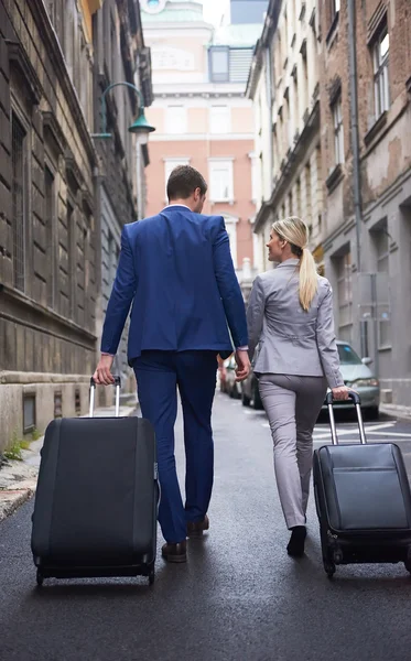 Business people couple entering  hotel