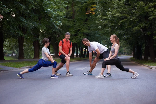 Jogging people group stretching