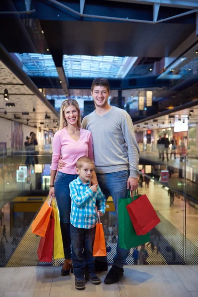 Young family with shopping bags