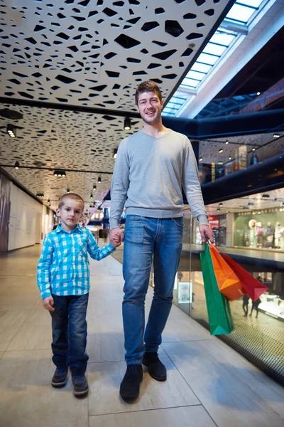 Young family with shopping bags