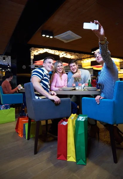 Friends have lunch break in shopping mall