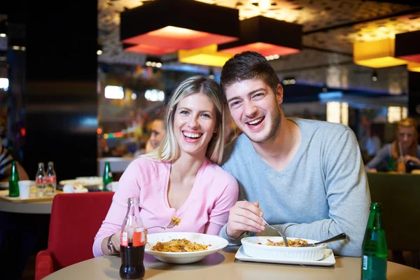 Couple having lunch break in shopping mall