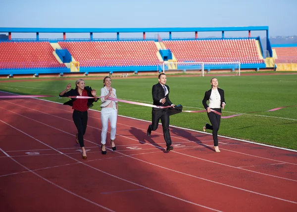 Business people running on racing track