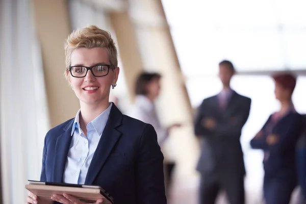 Business woman  at office with tablet  in front  as team leader