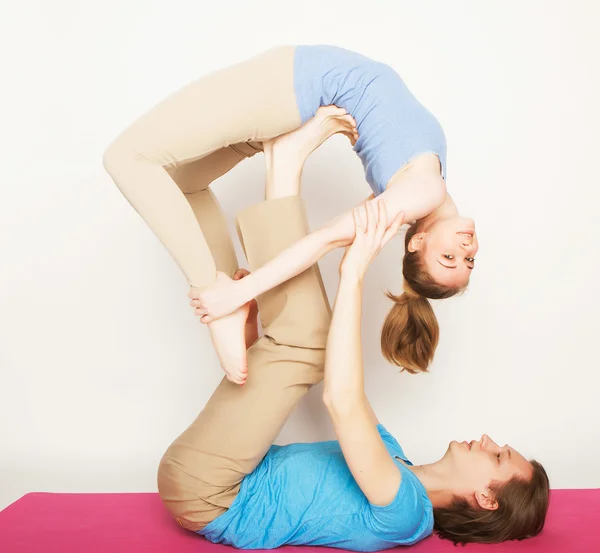 Young couple in yoga pose