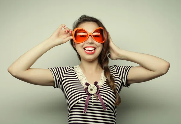 Young woman with big party glasses