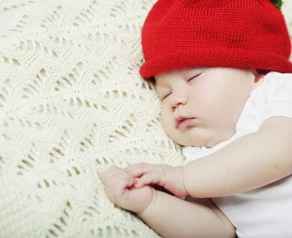 Sweet dream of baby in red hat