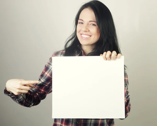 Young woman happy holding blank sign