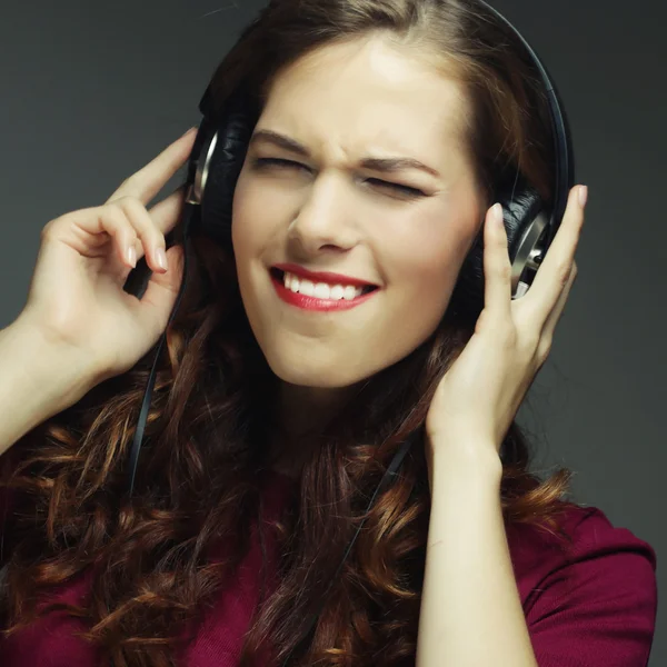 Young woman with headphones listening music