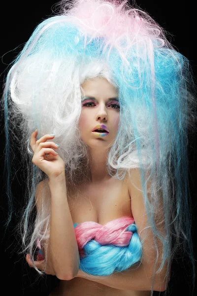 Model with bright make up and colorful hair